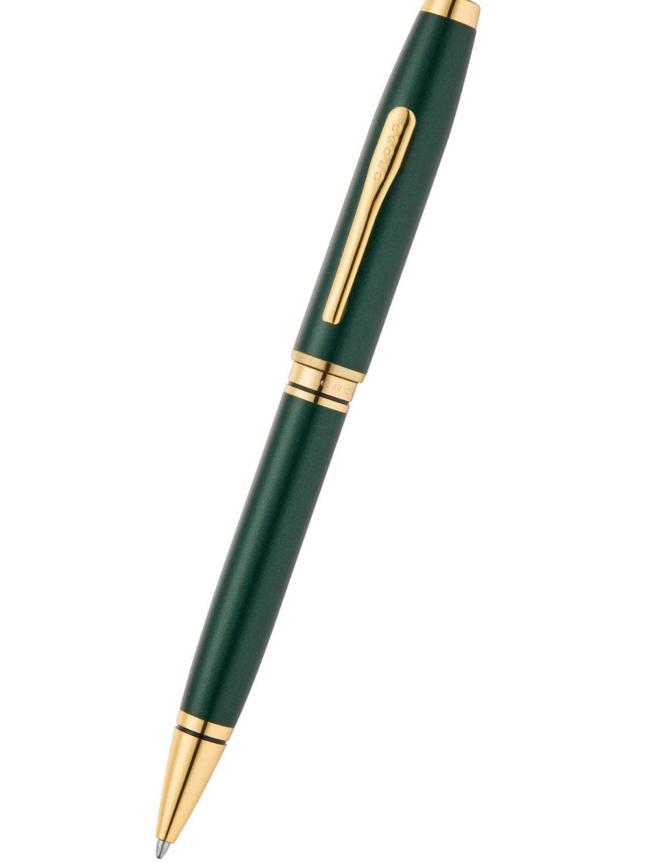 Green pen with gold accents on a white background