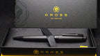 Black pen set with 'Cross' branding on a black box