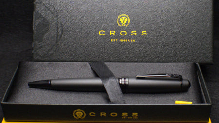 Black pen set with 'Cross' branding on a black box