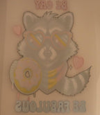Cartoon raccoon wearing sunglasses with a donut, on a light pink background.