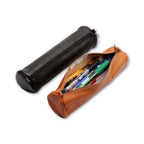 Brown leather pencil case with black lid containing pens on a white background