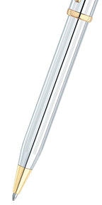 Silver pen with gold accents on a white background