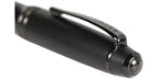Close-up of a black pen on a white background