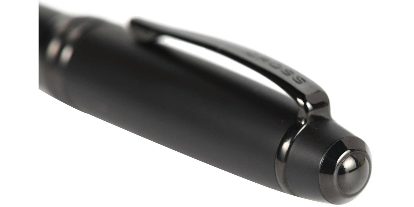 Close-up of a black pen on a white background