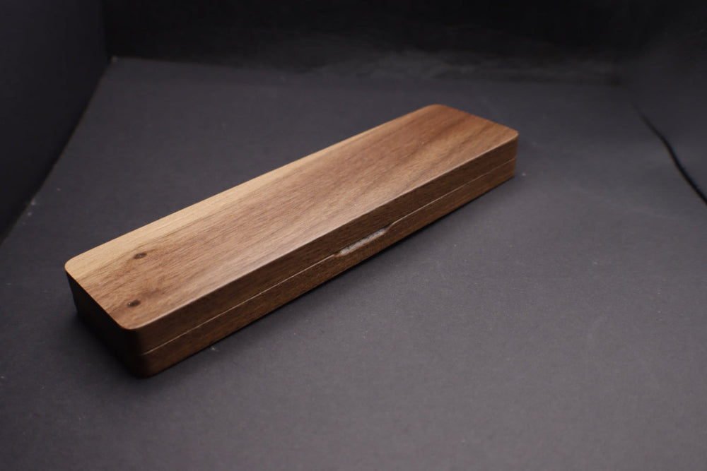 Wooden cutting board on a dark gray background