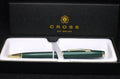 Green pen with gold accents in a Cross branded box