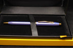 Purple pen with gold accents in a black and gold case
