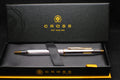 Cross pen and box set on a black background